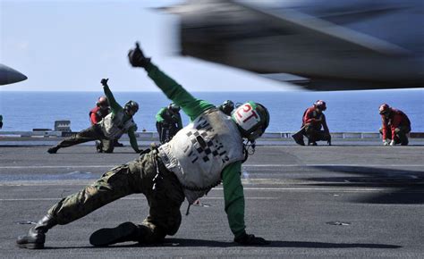 Fileus Navy 090624 N 2880m 020 Flight Deck Personnel Give A Thumbs Up