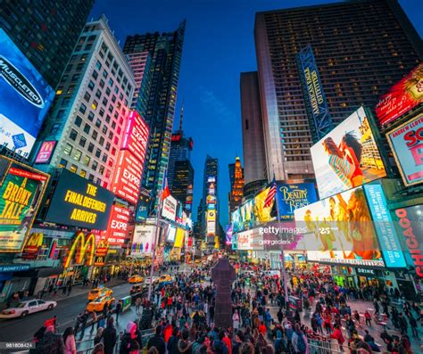 Need to compare more than just two places at once? Times Square In New York City At Dusk High-Res Stock Photo ...