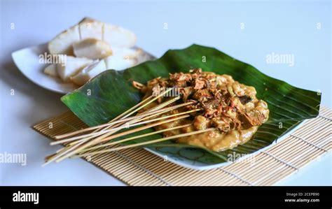 Sate Padang Or Padang Satay And Ketupat Traditional Rice Cake On