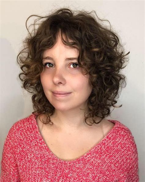 For curly curtain bangs, morales says you can achieve a gorgeous, natural effect without any tools. 16 Best Ways to Have Curly Hair with Bangs in 2020
