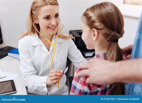 Delighted Young Doctor Checking Health Position Stock Photo Image Of