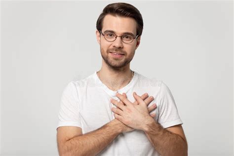 Guy Holding Hands On Chest Symbol Of Gratitude Studio Shot Stock Image