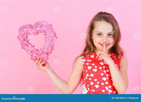 Secret And Silence Girl Holding Rosy Heart On Pink Background Stock