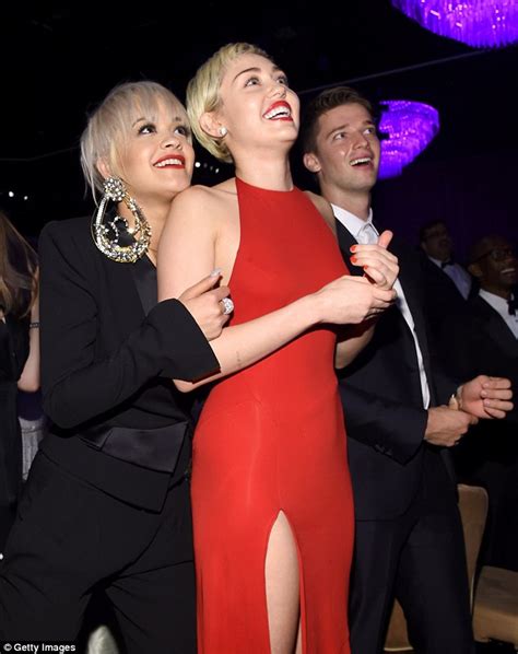 Miley Cyrus Puckers Up For A Kiss With Rita Ora At Pre Grammys Bash Daily Mail Online