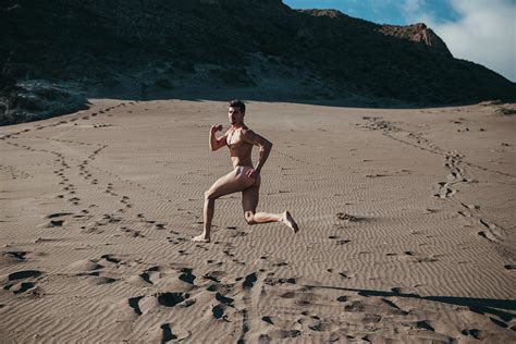 Naked Man Running Through The Desert Dunes Photograph By Cavan Images