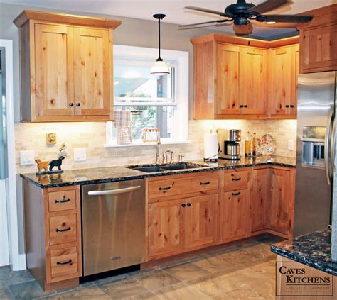 Rustic alder kitchen cabinets add to the homespun look of this space, which features an island that emulates a table filled with basket storage. Rustic Knotty Alder Kitchen with Weathered Beams - Rustic ...