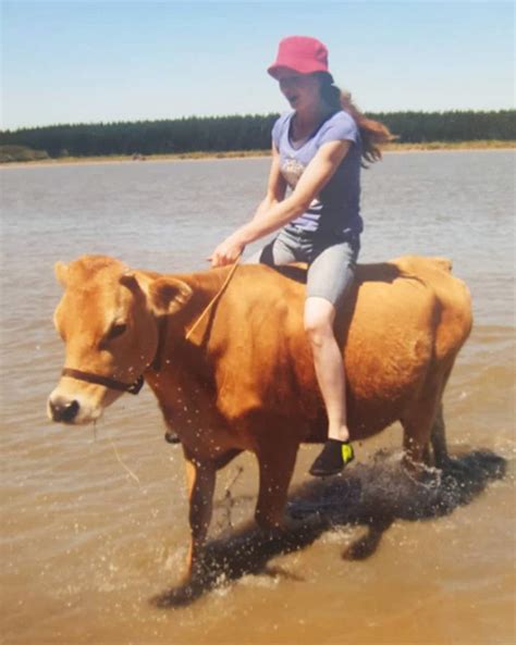 This Girl Rides A Cow Like Its No Big Deal Explore Awesome