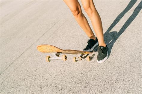 Young Teenage Girl Skates On Skateboard Takeoff Step Jump Stock