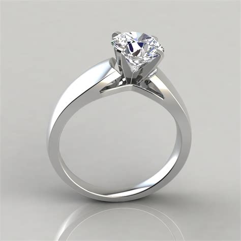 While a solid metal band in gold or platinum is the most common setting for this style, pavee and cabled settings are also popular. Wide Band Cathedral Style Solitaire Engagement Ring - PureGemsJewels