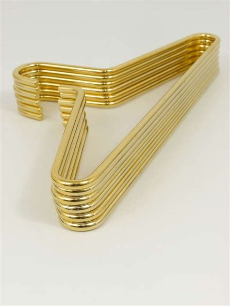 These wreath hangers fit nicely over a door and allow you product: Set of Six Carl Aubock Vienna Gold-Plated Brass Hangers at ...
