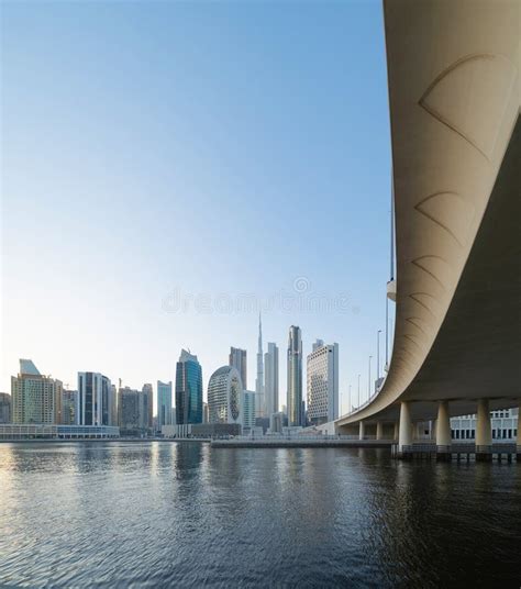 Burj Khalifa With Lake Or River And Bridge In Dubai Downtown Skyline