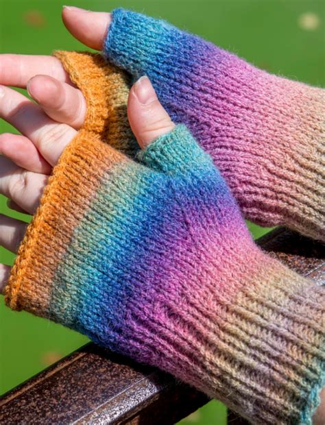 > bulky fingerless gloves on 2 straights. Rainbow Fingerless Mitten Pattern | AllFreeKnitting.com