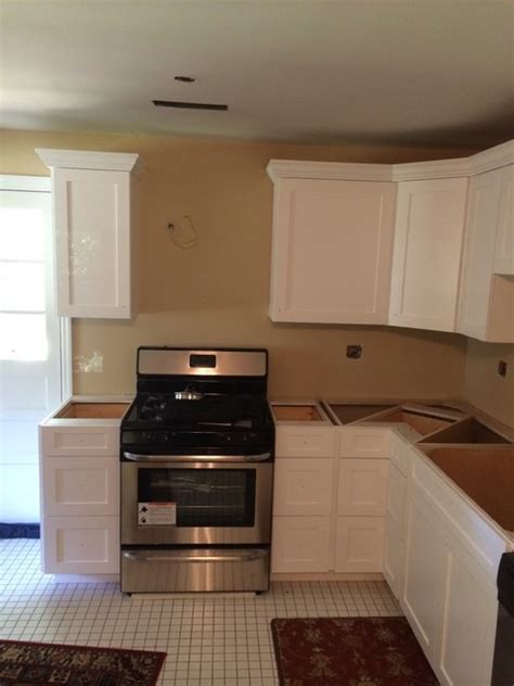 It is shipped in two separate pieces. White Shaker Style Kitchen with Detailed Crown Molding ...