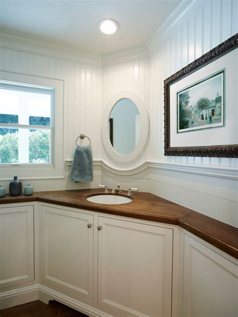 Corner bathroom vanities are the perfect addition for overcoming the drawbacks connected with having a small bathroom. corner vanity sink Spaces Transitional with cherry vanity ...