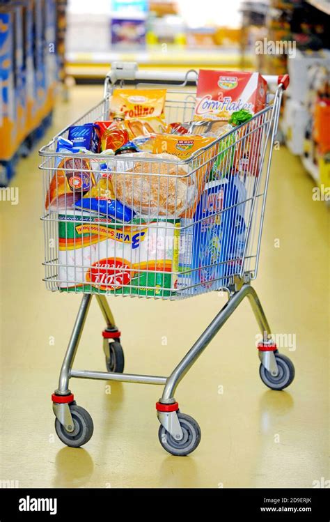 Shopping Cart Full In A Supermarket Stock Photo Alamy