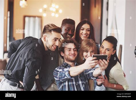 Multiracial People Having Fun At Cafe Taking A Selfie With Mobile Phone Group Of Young Friends