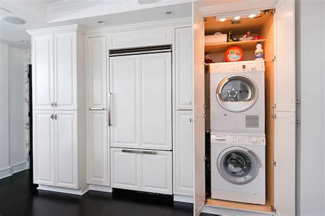 The washer and dryer may be two of your most treasured appliances, but that doesn't mean you want to stare at them all day. Hidden Washer and Dryer - kitchen - Dresner Design