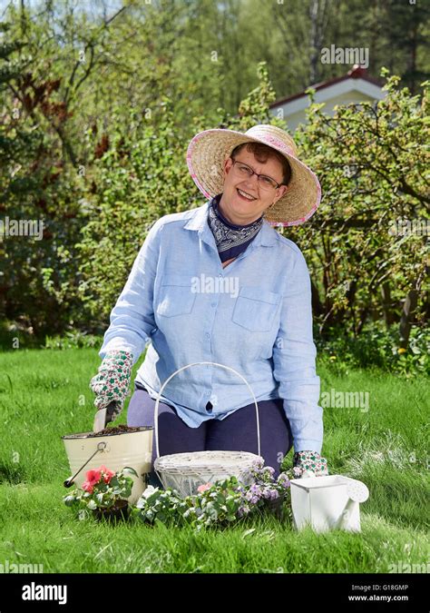 Mature Woman Planting Garden Flowers Hi Res Stock Photography And