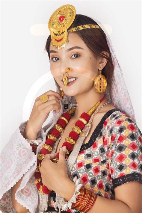 smiling portrait of limbu girl wearing dhungri and mundri on nose photos nepal