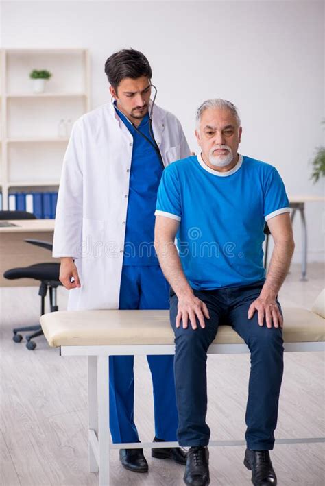 Old Male Patient Visiting Young Male Doctor Stock Image Image Of Care