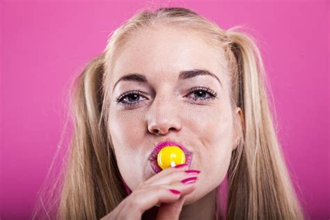 Headshot Of Blond Woman Licking Lollipop Stock Photo Image Of Real Lighting