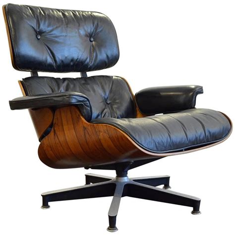 The eames molded fiberglass side chairs and armchairs were released through herman miller in 1950. Vintage 1970s Rosewood Eames 670 Lounge Chair For Sale at ...