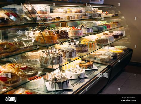 Pastry Shop Glass Display With Selection Of Cream Or Fruit Cake Stock
