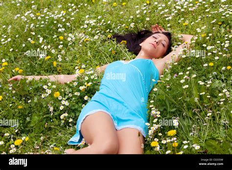 Girl Lying In A Meadow Stock Photo Alamy