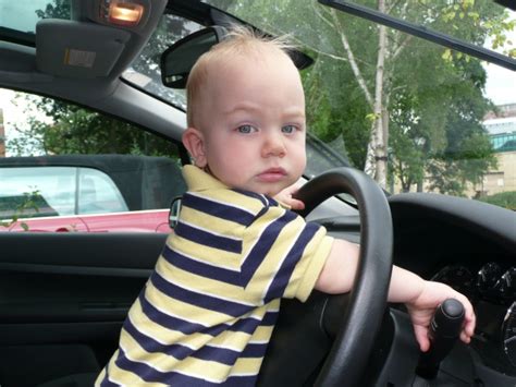 Little 2 Years Old Boy Drives A Car Free Stock Photo Public Domain
