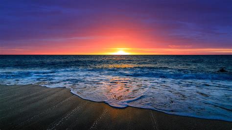 Nice Beautiful Ocean Waves Beach Sand In Purple Red Clouds Sky