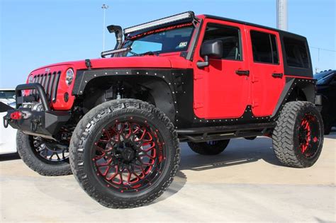 2014 Red Jeep Wrangler Unlimited Sport With 4″ Lift And 38″ Tires On 24