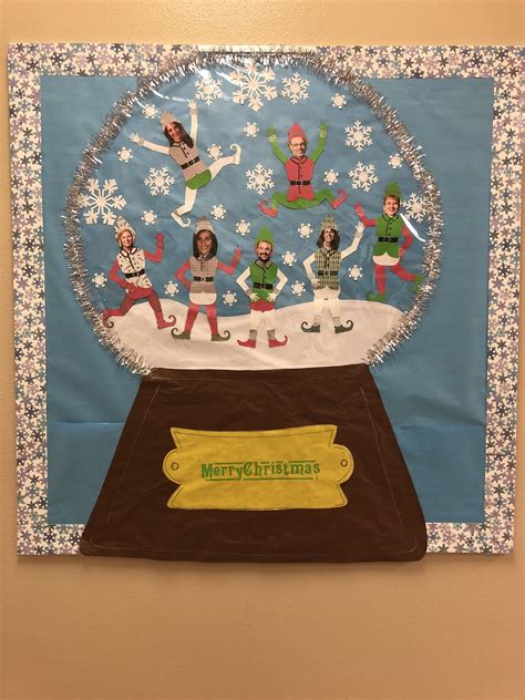 snow globe bulletin board for christmas with admin staff as elves christmas school preschool