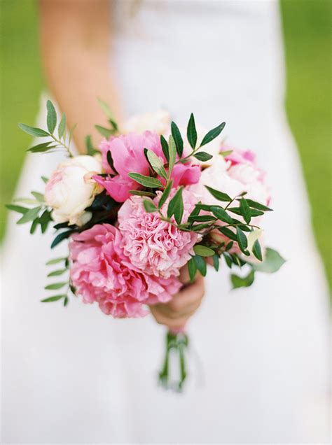 Maybe you would like to learn more about one of these? Simple pink peony wedding bouquet with green leaves