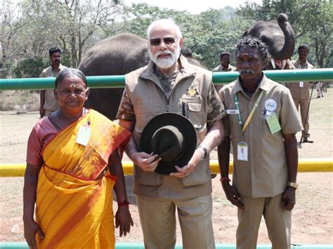 Pm Modi Poses With The Elephant Whisperers Bomman Bellie Raghu And