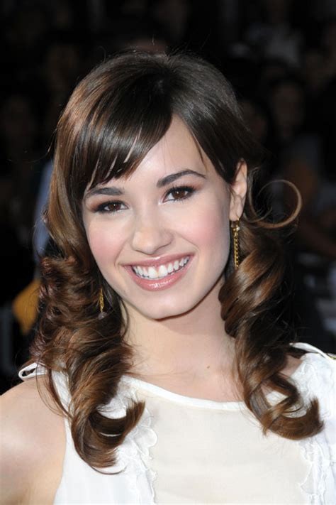 Demi Lovato Wavy Medium Brown Barrel Curls Sideswept Bangs Hairstyle