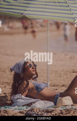 The Girl Sunbathes On The Beach Stock Photo Alamy