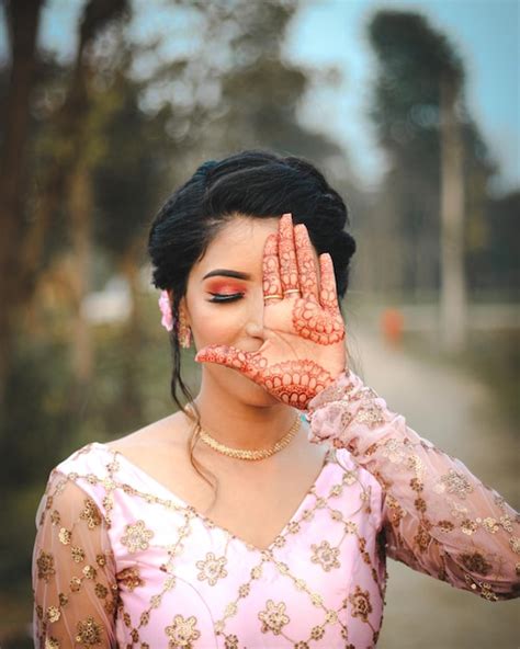 Premium Photo A Girl With Henna On Her Face