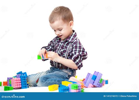 Baby Boy Playing With Blocks Toys On White Background Stock Photo