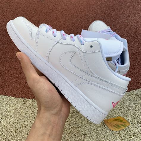 White is then seen on the toe, panels. Girls Shoes Air Jordan 1 Low White/Pink-Blue 554723-102