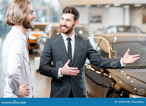 Salesperson With Client In The Car Showroom Stock Photo Image Of