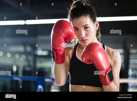 Female Chinese Boxer Practicing In Boxing Ring Stock Photo Alamy