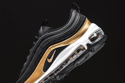 Black And Metallic Gold Cover This Nike Air Max 97 •