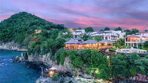 At The Foot Of A Cliff Sits Cap Maison S Naked Fisherman One Of Saint Lucia S Most Stunning