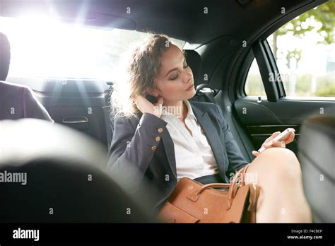 Inside Shot Of A Car With Woman Sitting With Her Eyes Closed On