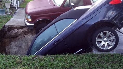 Hole Swallows Car In Palm Harbor Driveway Bronco Spared