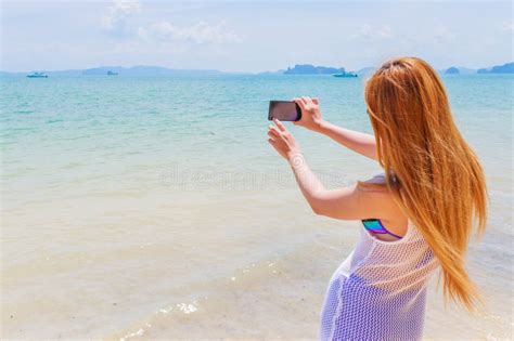Happy Attractive Blonde In Bikini Taking A Self Picture On A Beautiful Sunny Beach Stock Image