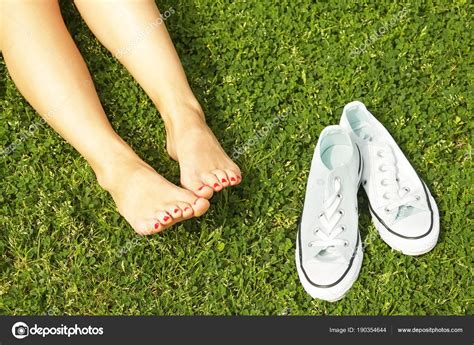 Female Bare Feet On Mawed Lawn Grass Young Woman Resting Outdoors Barefoot Take A Break