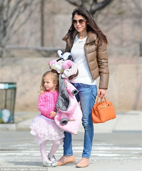 Bethenny Frankels Daughter Bryn Stands On Tiptoes To Push The