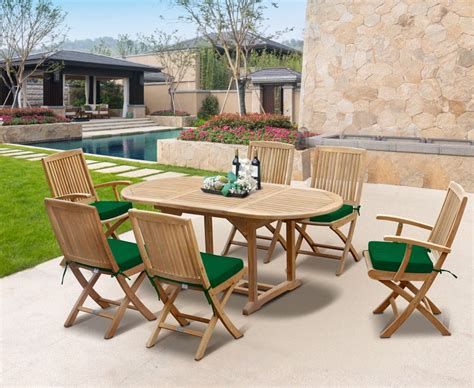Large solid patio table with 4 attached benches seats 8 with space in between forb4 chairs so can seat 12 hole in middle for umbrella just needs a touch of. Rimini Outdoor Extending Garden Table and Folding Chairs