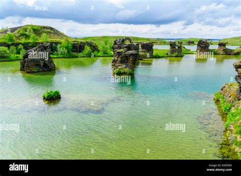 View Of Lake Myvatn With Various Volcanic Rock Formations And Birds